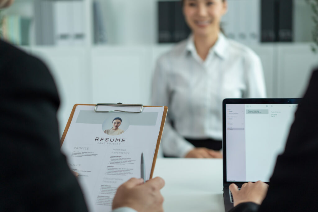 A young job applicant being interviewed by two hiring managers.